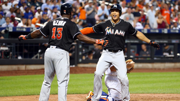 Jul 5, 2016; New York City, NY, USA; Miami Marlins right fielder Giancarlo Stanton (27) and Miami Marlins center fielder Marcell Ozuna (13) celebrate Stanton's two run home run against the New York Mets during the seventh inning at Citi Field. Photo Credit: Brad Penner-USA TODAY Sports