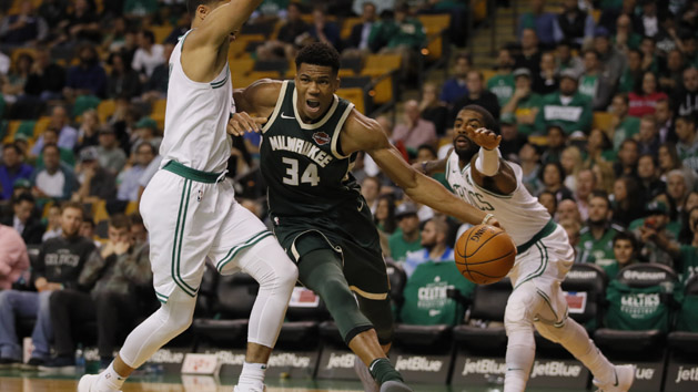 Oct 18, 2017; Boston, MA, USA; Milwaukee Bucks forward Giannis Antetokounmpo (34) drives the ball against Milwaukee Bucks guard Gary Payton II (0) and Boston Celtics guard Kyrie Irving (11) in the third quarter at TD Garden. Photo Credit: David Butler II-USA TODAY Sports