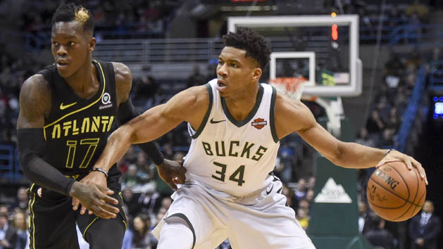 Feb 13, 2018; Milwaukee, WI, USA; Milwaukee Bucks forward Giannis Antetokounmpo (34) drives to the basket against Atlanta Hawks guard Dennis Schroder (17) in the first quarter at the BMO Harris Bradley Center. Photo Credit: Benny Sieu-USA TODAY Sports