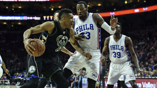Apr 10, 2016; Philadelphia, PA, USA; Milwaukee Bucks forward Giannis Antetokounmpo (34) drives to the net as Philadelphia 76ers forward Robert Covington (33) defends during the first quarter of the game at the Wells Fargo Center. Photo Credit: John Geliebter-USA TODAY Sports
