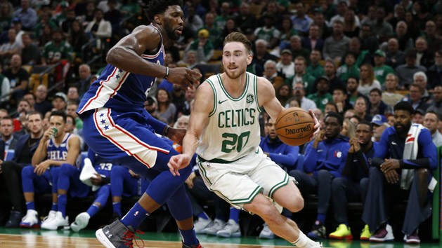 Oct 16, 2018; Boston, MA, USA; Boston Celtics guard Gordon Hayward (20) drives past Philadelphia 76ers center Joel Embiid (21) during the second half at TD Garden. Photo Credit: Greg M. Cooper-USA TODAY Sports