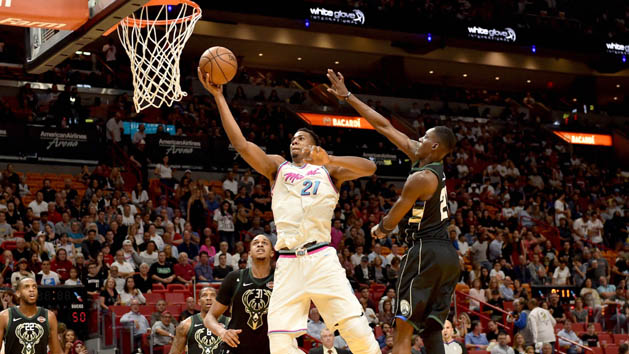 Feb 9, 2018; Miami, FL, USA; Miami Heat center Hassan Whiteside (21) drives to the basket past Milwaukee Bucks guard Tony Snell (21) during the second half an NBA game at the American Airlines Arena. The Heat won 91-85. Photo Credit: Steve Mitchell-USA TODAY Sports
