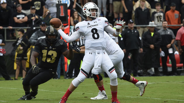Sep 10, 2016; West Lafayette, IN, USA; Cincinnati Bearcats quarterback Hayden Moore (8) leans back to throw as Purdue Boilermakers defensive end Gelen Robinson (13) closes in at Ross Ade Stadium. Photo Credit: Sandra Dukes-USA TODAY Sports