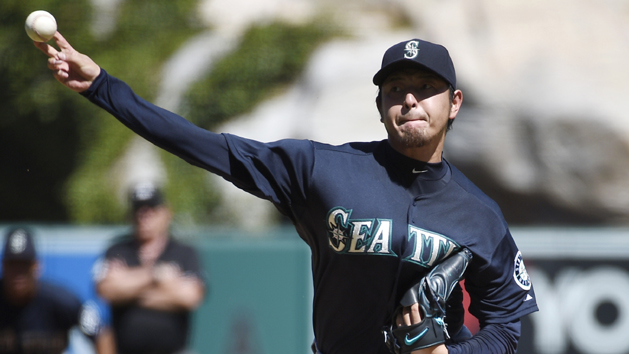 Sep 27, 2015; Anaheim, CA, USA; Seattle Mariners starting pitcher Hisashi Iwakuma (18) pitches against the Los Angeles Angels during the first inning at Angel Stadium of Anaheim. Mandatory Credit: Kelvin Kuo-USA TODAY Sports