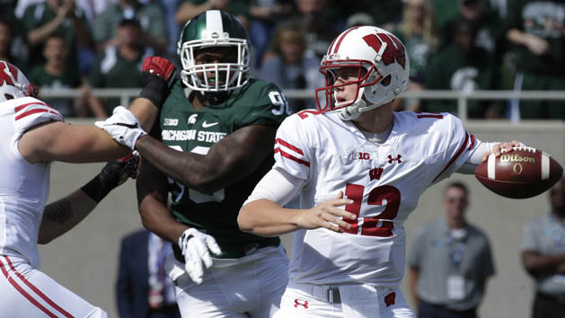 Sep 24, 2016; East Lansing, MI, USA; Wisconsin quarterback Alex Hornibrook (12) throws a pass during the third quarter of their game against Michigan State at Spartan Stadium. Photo Credit: Mark Hoffman/Milwaukee Journal Sentinel via USA TODAY Sports