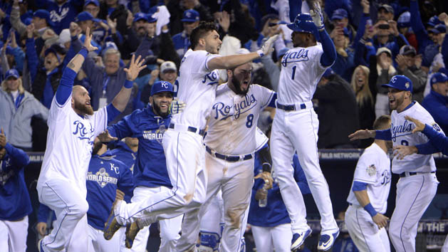 Oct 27, 2015; Kansas City, MO, USA; Kansas City Royals first baseman Eric Hosmer (35) is congratulated by teammates after driving in the winning run with a sacrifice fly against the New York Mets in the 14th inning in game one of the 2015 World Series at Kauffman Stadium. Mandatory Credit: John Rieger-USA TODAY Sports