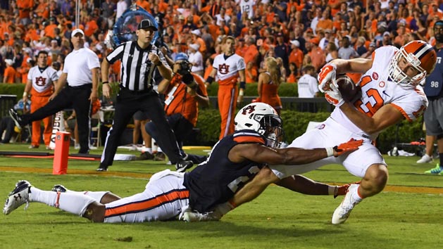Sep 3, 2016; Auburn, AL, USA; Clemson Tigers wide receiver Hunter Renfrow (13) scores a touchdown ahead of Auburn Tigers defensive back Johnathan Ford (23) during the fourth quarter at Jordan Hare Stadium. Photo Credit: Shanna Lockwood-USA TODAY Sports