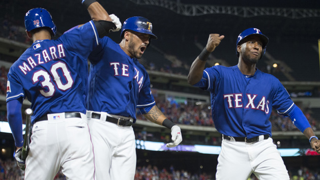 Jun 7, 2016; Arlington, TX, USA; Texas Rangers right fielder Nomar Mazara (30) and center fielder Ian Desmond (20) and first baseman Jurickson Profar (19) celebrate a two run home run by Desmond during the eighth inning against the Houston Astros at Globe Life Park in Arlington. The Rangers defeated the Astros 4-3. Photo Credit: Jerome Miron-USA TODAY Sports