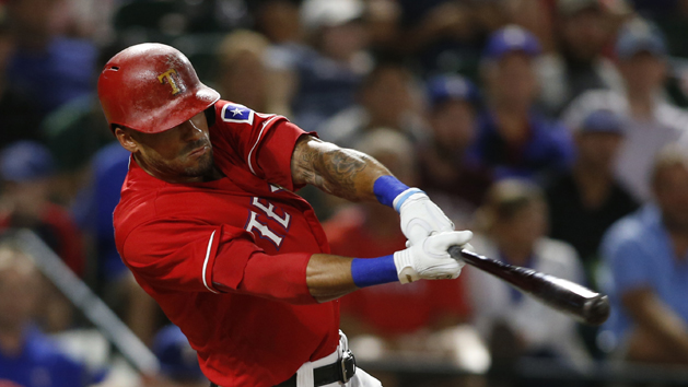 Aug 17, 2016; Arlington, TX, USA; Texas Rangers center fielder Ian Desmond (20) drives in two runs with a single in the fifth inning against the Oakland Athletics at Globe Life Park in Arlington. Photo Credit: Tim Heitman-USA TODAY Sports