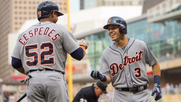 Jul 9, 2015; Minneapolis, MN, USA; Detroit Tigers second baseman Ian Kinsler (3) celebrates with left fielder Yoenis Cespedes (52) after hitting a home run in the first inning against the Minnesota Twins at Target Field. Mandatory Credit: Brad Rempel-USA TODAY Sports