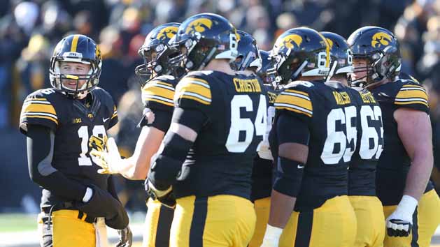 Nov 21, 2015; Iowa City, IA, USA; Iowa Hawkeyes quarterback C.J. Beathard (16) talks to his team during the third quarter in their game with the Purdue Boilermakers at Kinnick Stadium. Iowa beat Purdue 40-20. Mandatory Credit: Reese Strickland-USA TODAY Sports
