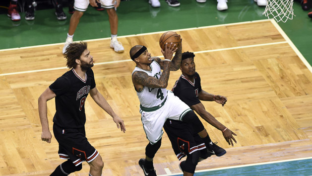 Apr 26, 2017; Boston, MA, USA; Boston Celtics guard Isaiah Thomas (4) drives to the basket past Chicago Bulls center Robin Lopez (8) and forward Jimmy Butler (21) during the second half in game five of the first round of the 2017 NBA Playoffs at TD Garden. Photo Credit: Bob DeChiara-USA TODAY Sports