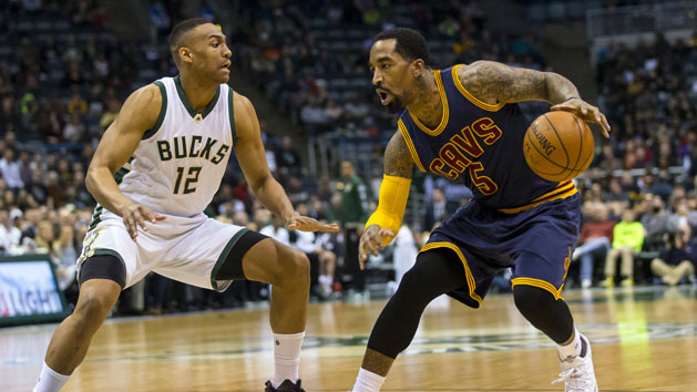 Apr 5, 2016; Milwaukee, WI, USA; Cleveland Cavaliers guard J.R. Smith (5) drives for the basket as Milwaukee Bucks forward Jabari Parker (12) defends during the first quarter at BMO Harris Bradley Center. Mandatory Credit: Jeff Hanisch-USA TODAY Sports