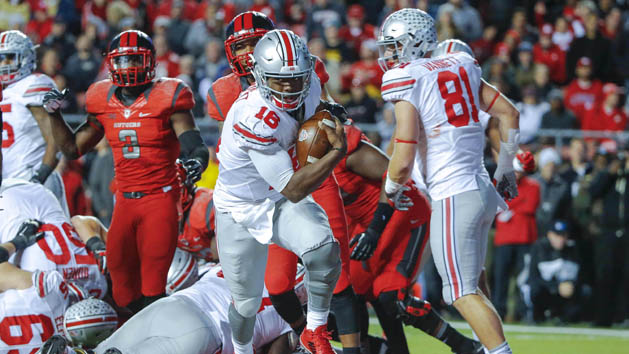 Oct 24, 2015; Piscataway, NJ, USA; Ohio State Buckeyes quarterback J.T. Barrett (16) crosses the goal line for second quarter touchdown against the Rutgers Scarlet Knights at High Points Solutions Stadium. Mandatory Credit: Jim O'Connor-USA TODAY Sports