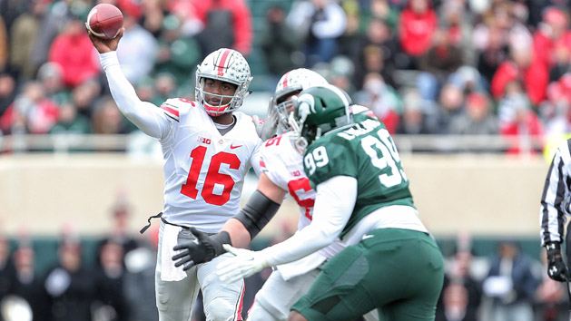 Nov 19, 2016; East Lansing, MI, USA; Ohio State Buckeyes quarterback J.T. Barrett (16) throws the ball against the Michigan State Spartans during the first quarter of a game at Spartan Stadium. Photo Credit: Mike Carter-USA TODAY Sports