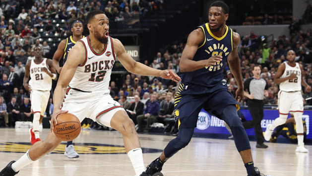 Mar 5, 2018; Indianapolis, IN, USA; Milwaukee Bucks forward Jabari Parker (12) drives to the basket against Indiana Pacers forward Thaddeus Young (21) during the first quarter at Bankers Life Fieldhouse. Photo Credit: Brian Spurlock-USA TODAY Sports