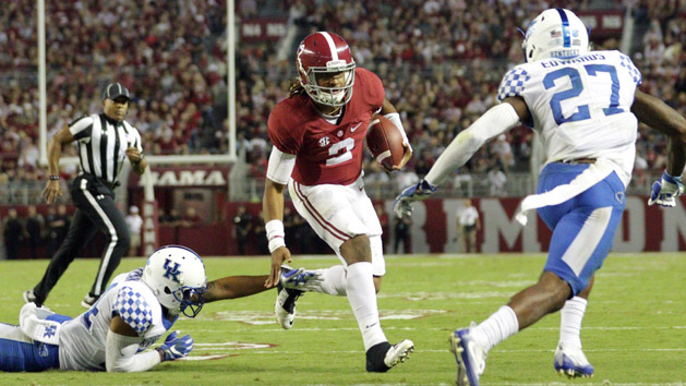 Oct 1, 2016; Tuscaloosa, AL, USA; Alabama Crimson Tide quarterback Jalen Hurts (2) gets out of reach of the Kentucky Wildcats defender at Bryant-Denny Stadium. The Crimson Tide defeated Kentucky 34-6. Photo Credit: Marvin Gentry-USA TODAY Sports