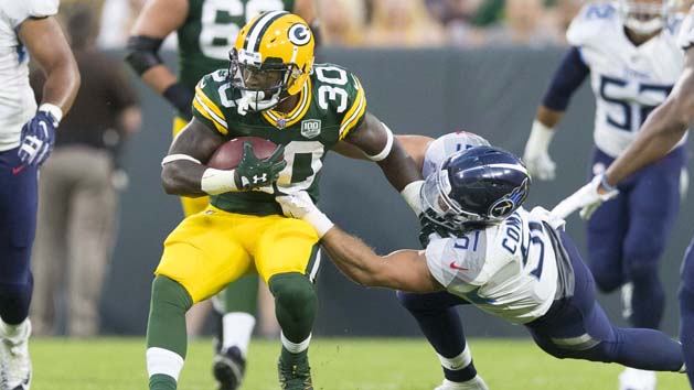 Aug 9, 2018; Green Bay, WI, USA; Green Bay Packers running back Jamaal Williams (30) is tackled by Tennessee Titans linebacker Will Compton (51) during the second quarter at Lambeau Field. Photo Credit: Jeff Hanisch-USA TODAY Sports