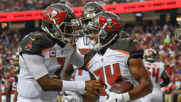 Sep 11, 2016; Atlanta, GA, USA; Tampa Bay Buccaneers running back Charles Sims (34) reacts with quarterback Jameis Winston (3) after scoring a touchdown against the Atlanta Falcons during the first half at the Georgia Dome. The Buccaneers won 31-24. Photo Credit: Dale Zanine-USA TODAY Sports