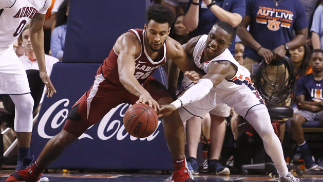 Feb 21, 2018; Auburn, AL, USA; Alabama Crimson Tide forward Braxton Key (25) battles for a loose ball with Auburn Tigers guard Jared Harper (1) during the second half at Auburn Arena. The Tigers beat the Tide 90-71. Photo Credit: John Reed-USA TODAY Sports