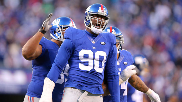 Dec 20, 2015; East Rutherford, NJ, USA; New York Giants defensive end Jason Pierre-Paul (90) reacts after blocking a pass by Carolina Panthers quarterback Cam Newton (not pictured) during the fourth quarter at MetLife Stadium. The Panthers defeated the Giants 38-35. Mandatory Credit: Brad Penner-USA TODAY Sports
