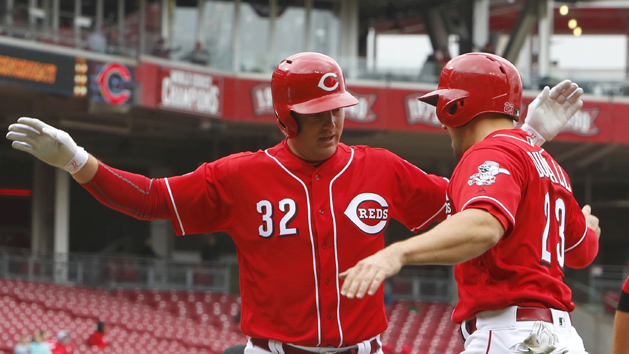 Apr 7, 2016; Cincinnati, OH, USA; Cincinnati Reds right fielder Jay Bruce (32) is congratulated by Reds left fielder Adam Duvall (23) after hitting a three-run home run against the Philadelphia Phillies during the fourth inning at Great American Ball Park. Mandatory Credit: David Kohl-USA TODAY Sports