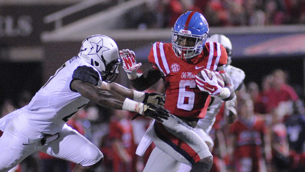 Sep 26, 2015; Oxford, MS, USA; Mississippi Rebels running back Jaylen Walton (6) stiff arms Vanderbilt Commodores safety Jahmel McIntosh (27) during the game at Vaught-Hemingway Stadium. Mississippi Rebels beat Vanderbilt Commodores 27-16. Mandatory Credit: Justin Ford-USA TODAY Sports