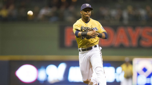 Aug 18, 2015; Milwaukee, WI, USA; Milwaukee Brewers shortstop Jean Segura (9) throws to first base during the fifth inning against the Miami Marlins at Miller Park. Mandatory Credit: Jeff Hanisch-USA TODAY Sports