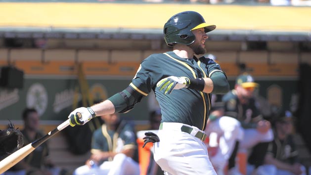 basSep 20, 2018; Oakland, CA, USA; Oakland Athletics second baseman Jed Lowrie (8) hits an RBI single against the Los Angeles Angels during the fourth inning at Oakland Coliseum. Photo Credit: Kelley L Cox-USA TODAY Sports
