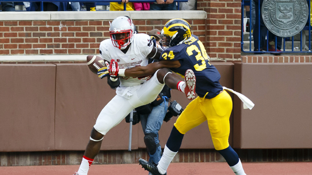 Sep 19, 2015; Ann Arbor, MI, USA; Michigan Wolverines safety Jeremy Clark (34) breaks up a pass to UNLV Rebels wide receiver Kendal Keys (84) in the fourth quarter at Michigan Stadium. Mandatory Credit: Rick Osentoski-USA TODAY Sports