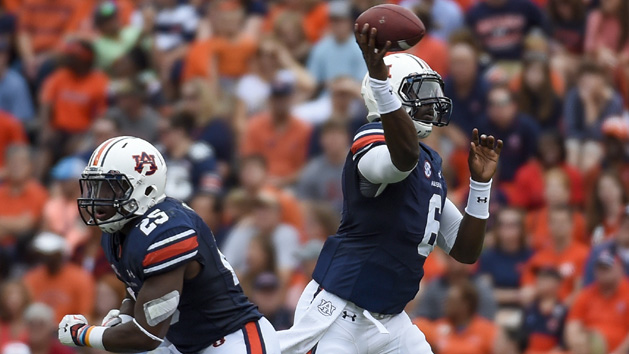 Sep 12, 2015; Auburn, AL, USA; Auburn Tigers quarterback Jeremy Johnson (6) passes the ball as running back Peyton Barber (25) runs during the first quarter at Jordan Hare Stadium. Mandatory Credit: Shanna Lockwood-USA TODAY Sports