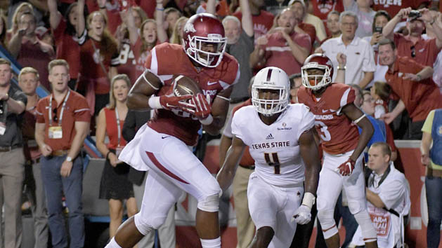 Sep 17, 2016; Fayetteville, AR, USA; Arkansas Razorbacks tight end Jeremy Sprinkle (83) scores a touchdown in front of Texas State Bobcats cornerback Quinn Tiggs (4) during the first half at Donald W. Reynolds Razorback Stadium. Photo Credit: Denny Medley-USA TODAY Sports