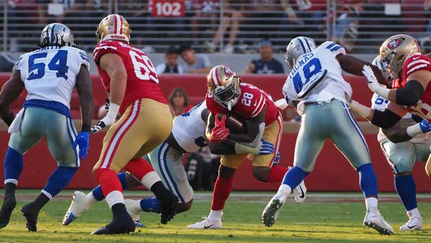 Aug 9, 2018; Santa Clara, CA, USA; San Francisco 49ers running back Jerick McKinnon (28) is brought down against the Dallas Cowboys during the first quarter at Levi's Stadium. Photo Credit: Kelley L Cox-USA TODAY Sports