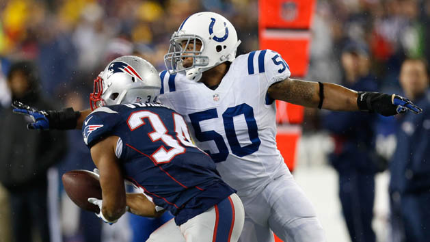 Jan 18, 2015; Foxborough, MA, USA; New England Patriots running back Shane Vereen (34) attempts a catch while being defended by Indianapolis Colts line backer Jerrell Freeman (50) during the first quarter in the AFC Championship Game at Gillette Stadium. Mandatory Credit: Greg M. Cooper-USA TODAY Sports