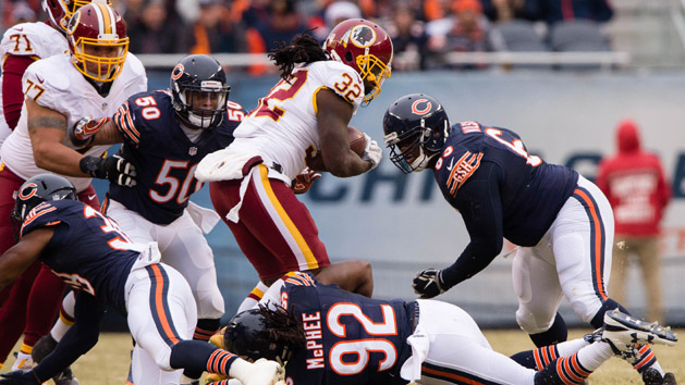 Dec 24, 2016; Chicago, IL, USA; Washington Redskins running back Rob Kelley (32) and Chicago Bears inside linebacker Jerrell Freeman (50) and outside linebacker Pernell McPhee (92) and defensive end C.J. Wilson (69) during the game at Soldier Field. The Redskins defeat the Bears 41-21. Photo Credit: Jerome Miron-USA TODAY Sports