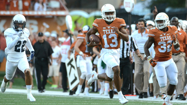 Sep 12, 2015; Austin, TX, USA; Texas Longhorns quarterback Jerrod Heard (13) runs the ball against the Rice Owls during the first quarter at Darrell K Royal-Texas Memorial Stadium. Mandatory Credit: Brendan Maloney-USA TODAY Sports