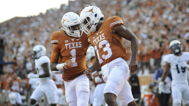 Sep 12, 2015; Austin, TX, USA; Texas Longhorns quarterback Jerrod Heard (13) and wide receiver John Burt (1) react against the Rice Owls during the first quarter at Darrell K Royal-Texas Memorial Stadium. Mandatory Credit: Brendan Maloney-USA TODAY Sports