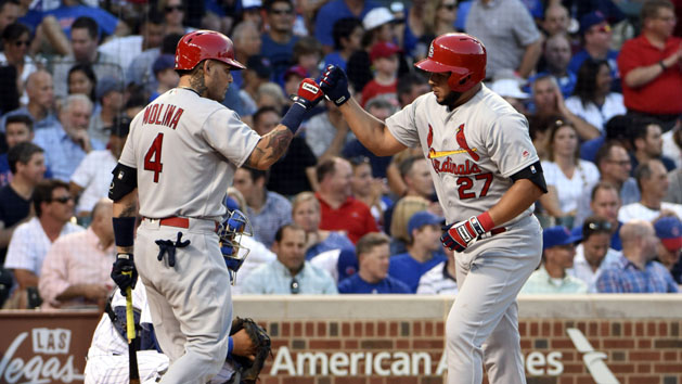 Jun 20, 2016; Chicago, IL, USA; St. Louis Cardinals third baseman Jhonny Peralta (27) is greeted by catcher Yadier Molina (4) after hitting a home run against the Chicago Cubs during the third inning at Wrigley Field. Photo Credit: David Banks-USA TODAY Sports