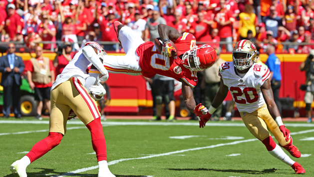 Sep 23, 2018; Kansas City, MO, USA; Kansas City Chiefs wide receiver Tyreek Hill (10) catches a pass as San Francisco 49ers cornerbacks Jimmie Ward (20) and Adrian Colbert (27) defend in the first half at Arrowhead Stadium. Photo Credit: Jay Biggerstaff-USA TODAY Sports