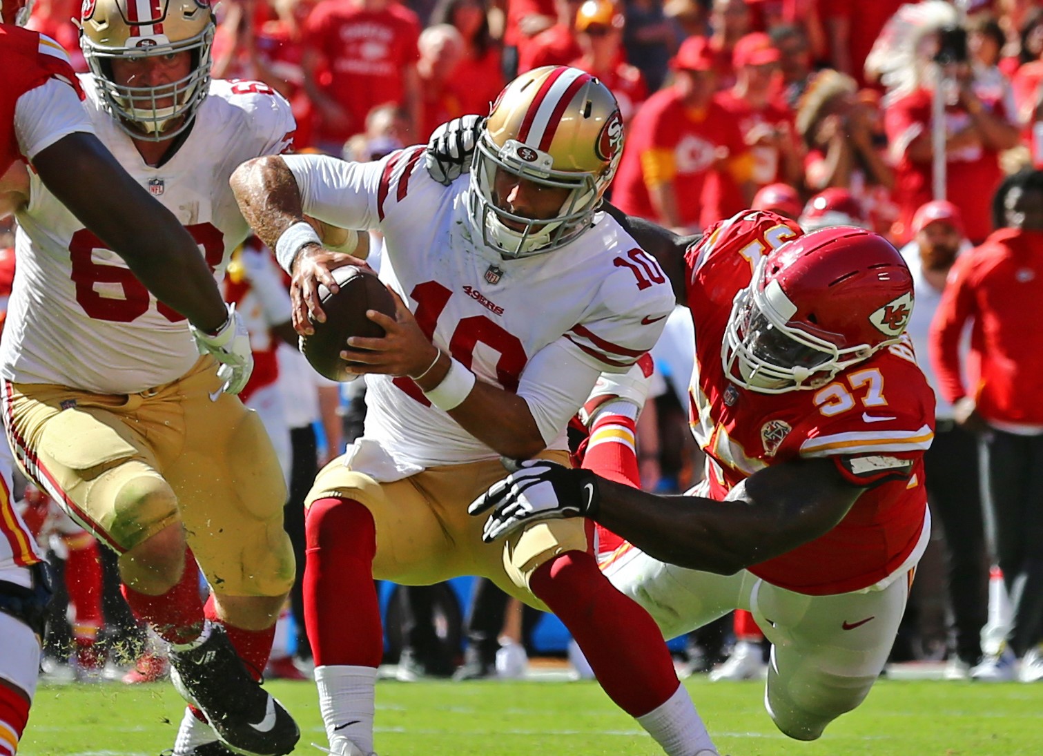 Sep 23, 2018; Kansas City, MO, USA; San Francisco 49ers quarterback Jimmy Garoppolo (10) is tackled by Kansas City Chiefs defensive end Allen Bailey (97) in the second half at Arrowhead Stadium. Photo Credit: Jay Biggerstaff-USA TODAY Sports