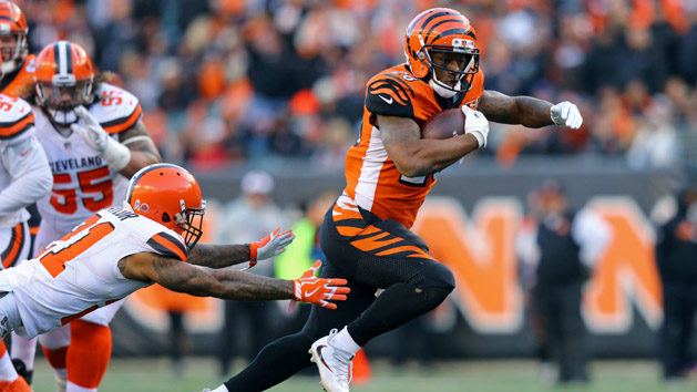 Nov 26, 2017; Cincinnati, OH, USA; Cincinnati Bengals running back Joe Mixon (28) avoids a tackle from Cleveland Browns cornerback Jamar Taylor (21) in the second half at Paul Brown Stadium. Photo Credit: Aaron Doster-USA TODAY Sports