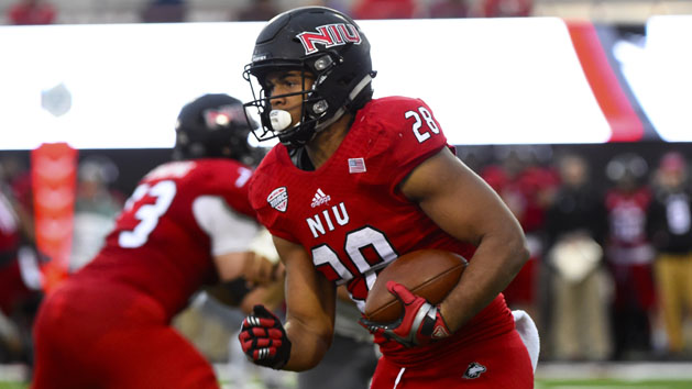 Oct 24, 2015; DeKalb, IL, USA; Northern Illinois Huskies running back Joel Bouagnon (28) rushes the ball against the Eastern Michigan Eagles during the second half at Huskie Stadium. Mandatory Credit: Mike DiNovo-USA TODAY Sports