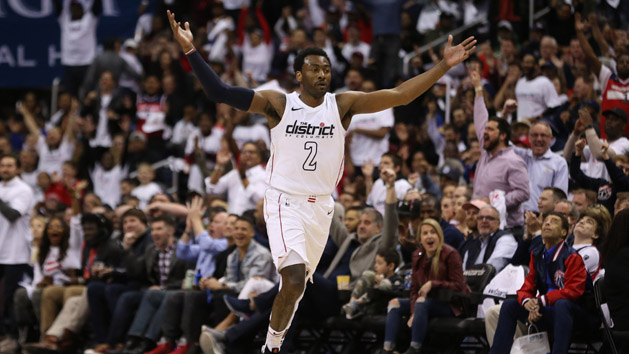 Apr 20, 2018; Washington, DC, USA; Washington Wizards guard John Wall (2) celebrates on the court against the Toronto Raptors in the fourth quarter in game three of the first round of the 2018 NBA Playoffs at Capital One Arena. The Wizards won 122-103. Photo Credit: Geoff Burke-USA TODAY Sports