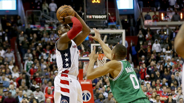 May 12, 2017; Washington, DC, USA; Washington Wizards guard John Wall (2) makes the game winning three-point field goal over Boston Celtics guard Avery Bradley (0) in the final seconds of the fourth quarter in game six of the second round of the 2017 NBA Playoffs at Verizon Center. The Wizards won 92-91, and tied the series at 3-3. Photo Credit: Geoff Burke-USA TODAY Sports