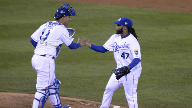 Oct 28, 2015; Kansas City, MO, USA; Kansas City Royals starting pitcher Johnny Cueto (47) celebrates with catcher Salvador Perez (13) after defeating the New York Mets in game two of the 2015 World Series at Kauffman Stadium. Mandatory Credit: John Rieger-USA TODAY Sports