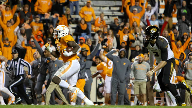 Nov 19, 2016; Knoxville, TN, USA; Tennessee Volunteers defensive lineman Jonathan Kongbo (1) returns an interception for a touchdown against the Missouri Tigers during the second half at Neyland Stadium. Tennessee won 63 to 37. Photo Credit: Randy Sartin-USA TODAY Sports