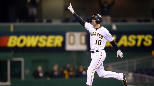 Apr 5, 2016; Pittsburgh, PA, USA; Pittsburgh Pirates shortstop Jordy Mercer (10) celebrates his game winning RBI single against the St. Louis Cardinals during the eleventh inning at PNC Park. The Pirates won 6-5 in eleven innings. Mandatory Credit: Charles LeClaire-USA TODAY Sports