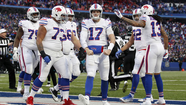 Nov 25, 2018; Orchard Park, NY, USA; Buffalo Bills quarterback Josh Allen (17) celebrates his touchdown with offensive tackle Dion Dawkins (73) and wide receiver Kelvin Benjamin (13) during the second half against the Jacksonville Jaguars at New Era Field. Photo Credit: Timothy T. Ludwig-USA TODAY Sports