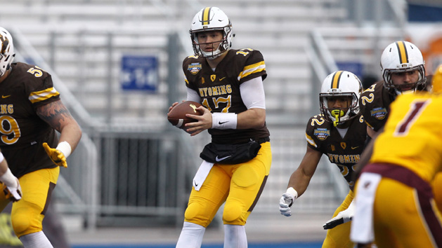 Dec 22, 2017; Boise, ID, USA; Wyoming Cowboys quarterback Josh Allen (17) takes the snap from center during the first half of the 2017 Potato Bowl versus Central Michigan Chippewas at Albertsons Stadium. Photo Credit: Brian Losness-USA TODAY Sports
