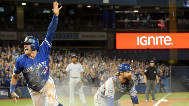 Oct 9, 2016; Toronto, Ontario, CAN; Toronto Blue Jays third baseman Josh Donaldson (20) celebrates after scoring the winning run past Texas Rangers catcher Jonathan Lucroy (25) in the 10th inning to give the Jays a three game sweep in 2016 ALDS playoff at Rogers Centre. Photo Credit: Dan Hamilton-USA TODAY Sports
